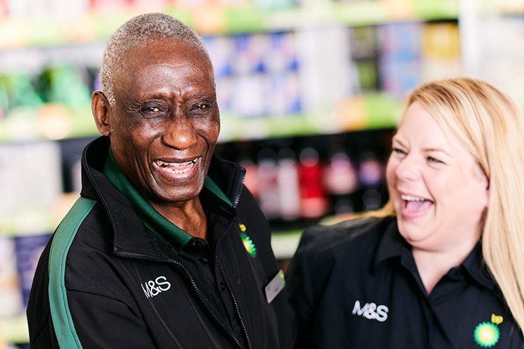 two colleagues laughing